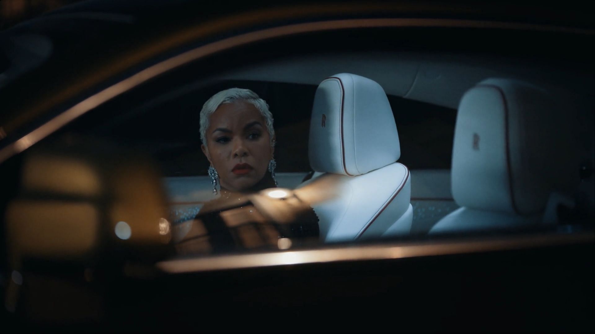 Rasheda sits alone in the car after the hospital visit, reflecting on her strained marriage in Tyler Perry’s Divorced Sistas season 1 ( Image via BET+)